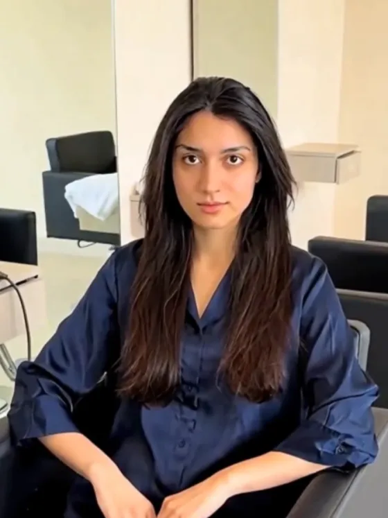 A client in a salon chair, as photographed